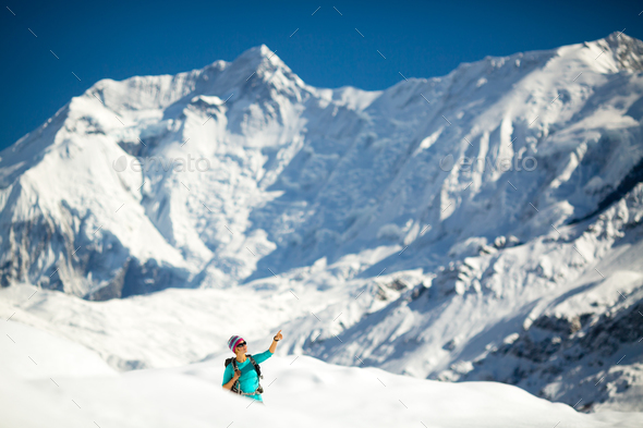 Woman success portrait on mountain peak - Stock Photo - Images