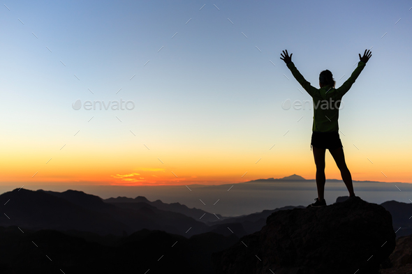 Woman climber success silhouette in mountains, achievement inspi Stock Photo by blas
