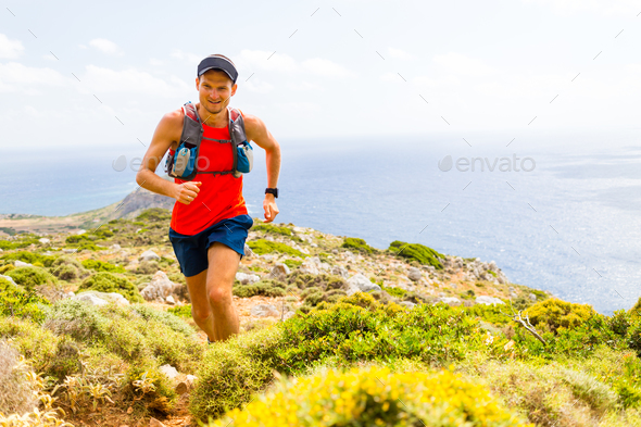 Mountain running man in inspirational landscape - Stock Photo - Images