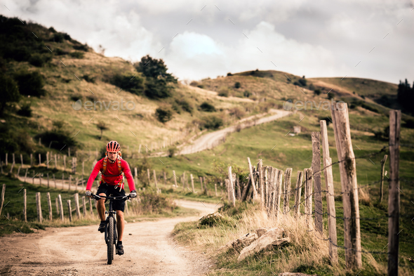 Mountain biker riding MTB - Stock Photo - Images