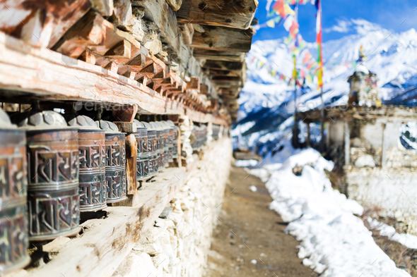 Prayer wheels in high Himalaya Mountains, Nepal village - Stock Photo - Images