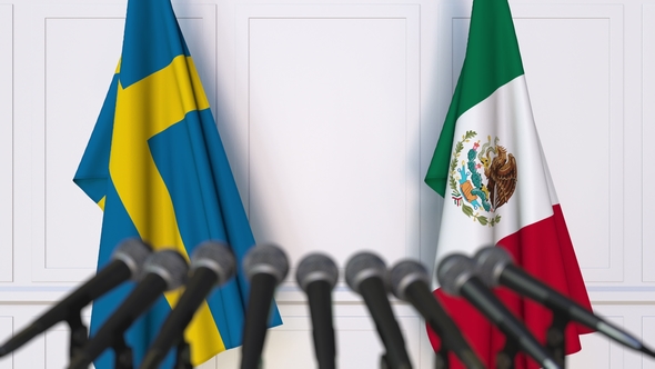 Flags Of Sweden And Mexico At International Press Conference, Motion 