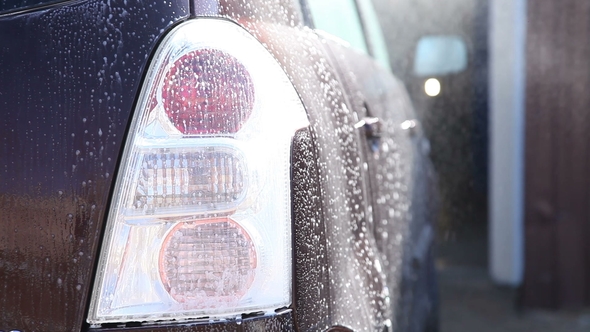 Washing a Dirty Car with Foam