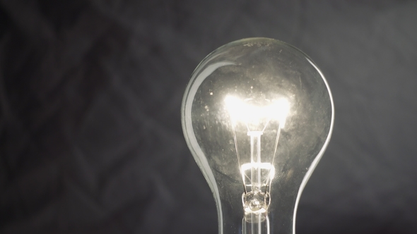 Light Bulb on Dark Background alt