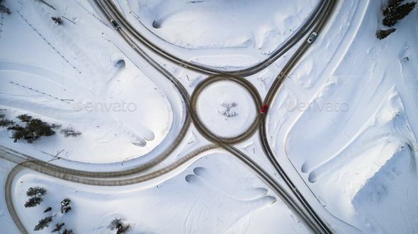 Aerial view of a winter road. Winter landscape countryside. Aerial photography of snow forest.