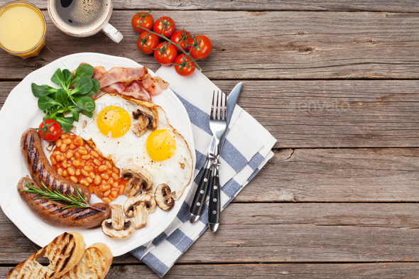 English breakfast. Fried eggs, sausages, bacon - Stock Photo - Images