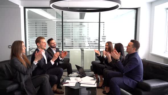a Group of Businessmen Claps Their Hands and Celebrate the Deal, Slow Motion