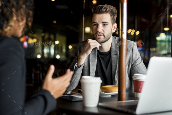 Business partners working together at a cafe Stock Photo by Rawpixel