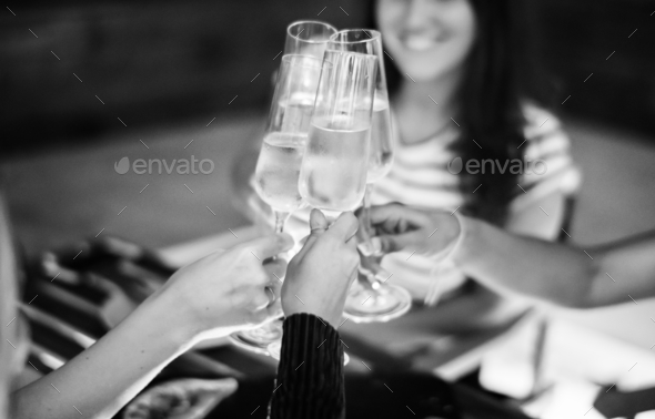 Girl friends toasting at dinner together at a rooftop bar Stock Photo by Rawpixel