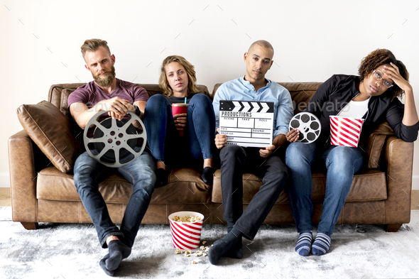 Sad group of friends holding movie and film objects Stock Photo by Rawpixel