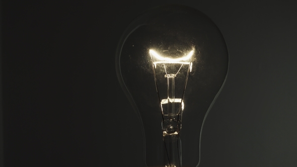 Light Bulb on Black Background. Idea Light Bulb