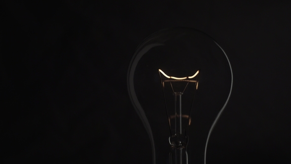 Light Bulb on Black Background. Idea Light Bulb
