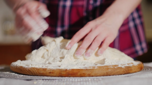 The Baker's Hands Knead the Pizza Dough. Video with Shallow Depth of Field alt