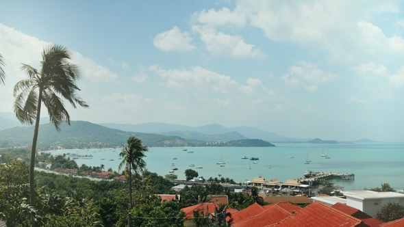 Bright Sun Coming Out Behing Cloud on Blue Sky Over Ship and Sea Yachts alt