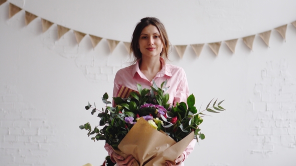 Portrait of Florist with Big Modern Bouquet of Different Flowers