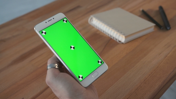 Man Using Phone with Green Screen Hold in Hands alt