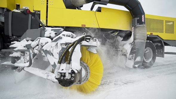Heavy Wheel Machinery Removes Snow From the Road with Big Massive Rotating Brush in the Snowy alt