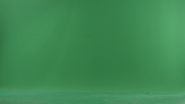A Young Woman Going From Left Side with Her Baby on the Green Screen