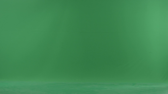 A Young Woman Going From the Right Side with Her Baby on the Green Screen