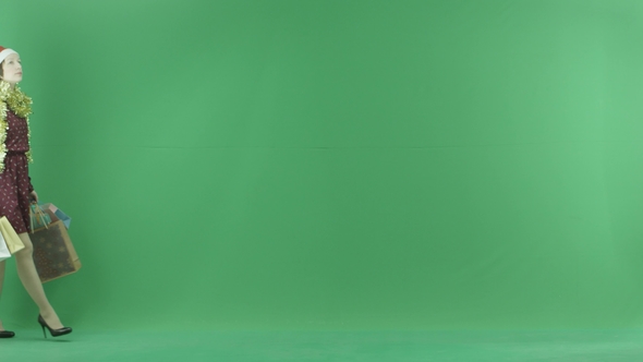 A Young Girl on Shopping Is Going From the Left Side and Looking for Something New on the Green