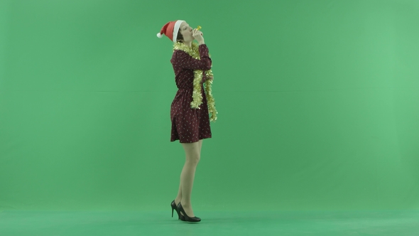A Young Woman Dancing To the Right Side of the Green Screen