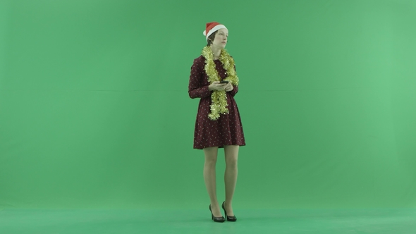 A Young Woman Sees Something Sad Into Her Phone on the Green Screen