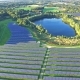Aerial Shot of Solar Power Plant with Beautiful Lake - VideoHive Item for Sale
