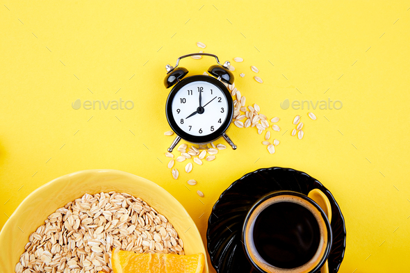 Morning coffee, granola breakfast, alarm clock - Stock Photo - Images