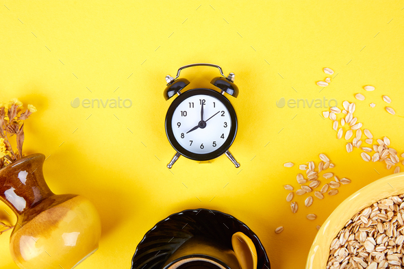 Morning coffee, granola breakfast, alarm clock - Stock Photo - Images