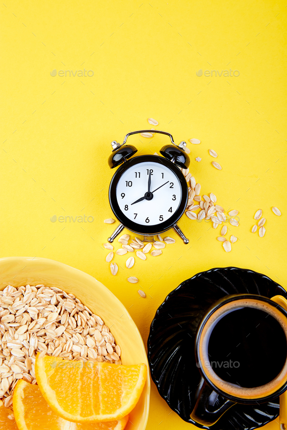 Morning coffee, granola breakfast, alarm clock - Stock Photo - Images