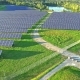 Aerial Shot of Solar Power Plant with Beautiful Lake  - VideoHive Item for Sale