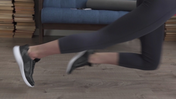 Woman's Legs Running During an Exercise Mountain Climber on Floor at Home