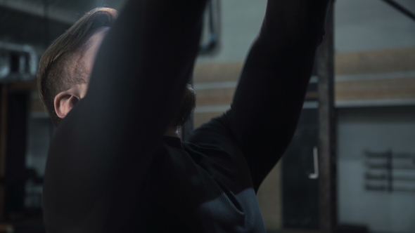 Man Training with Weight Ball alt