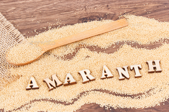 Inscription amaranth and seeds containing vitamins, minerals and fiber, healthy and gluten free food - Stock Photo - Images