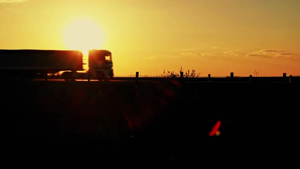 Truck Riding Against Sunset Sky alt