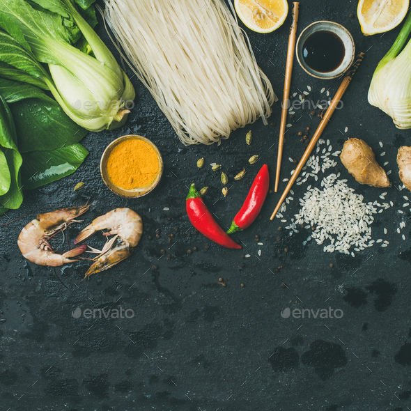 Asian cuisine ingredients over dark slate stone background, square crop - Stock Photo - Images
