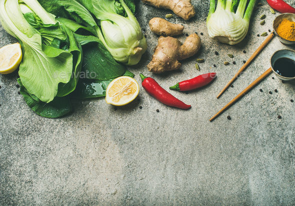 Flat-lay of Asian cuisine ingredients over concrete background, copy space - Stock Photo - Images