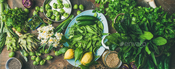 Spring healthy vegan food cooking ingredients, wooden background, wide composition - Stock Photo - Images