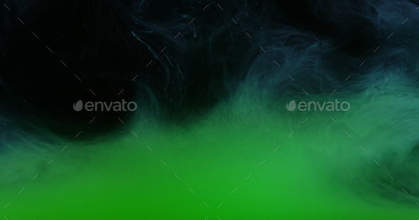 Green Ink Colors in Water Creating Liquid Art Shapes - Stock Photo - Images