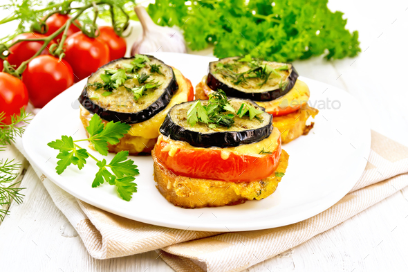 Appetizer of aubergines and cheese on napkin - Stock Photo - Images