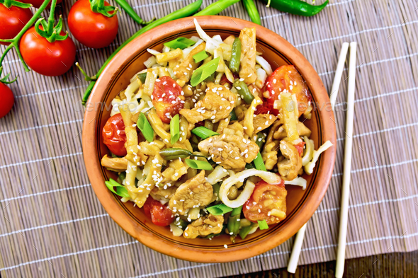 Noodles wok Thai in plate on bamboo top - Stock Photo - Images