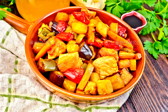 Roast with vegetables and honey in pan on board - Stock Photo - Images