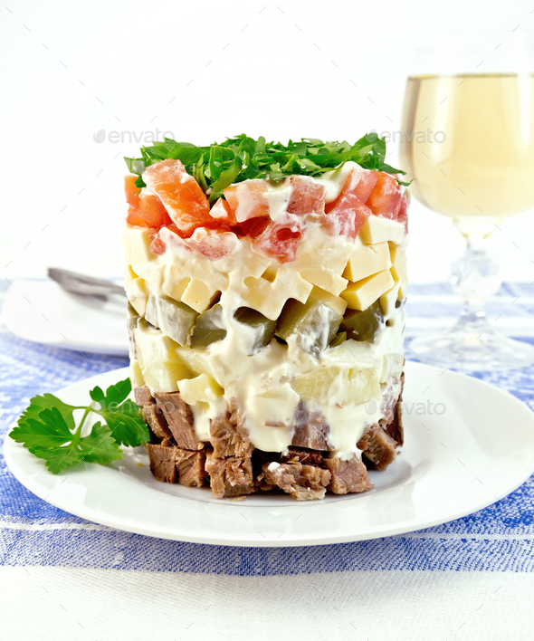 Salad with beef and tomato on tablecloth - Stock Photo - Images