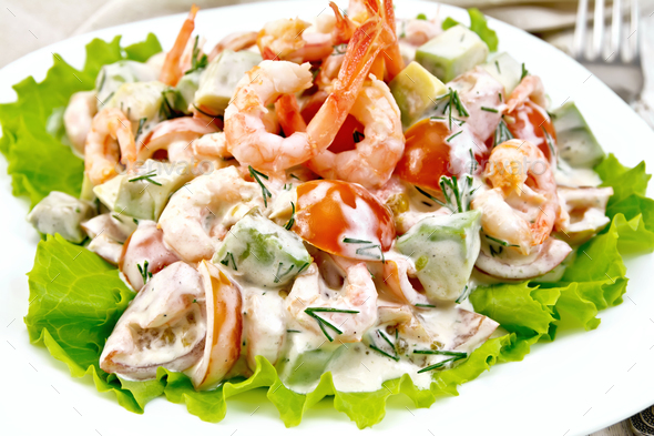 Salad with shrimp and avocado in plate - Stock Photo - Images