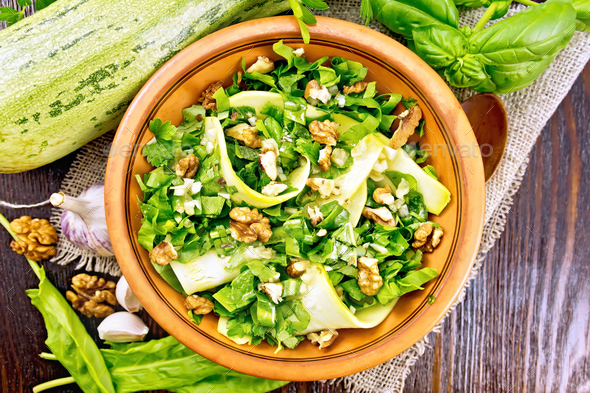 Salad with squash and sorrel on board top - Stock Photo - Images