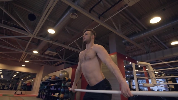 Muscular Man Training with Light Crossbar, Squat Exercise and Lifting Exercise alt