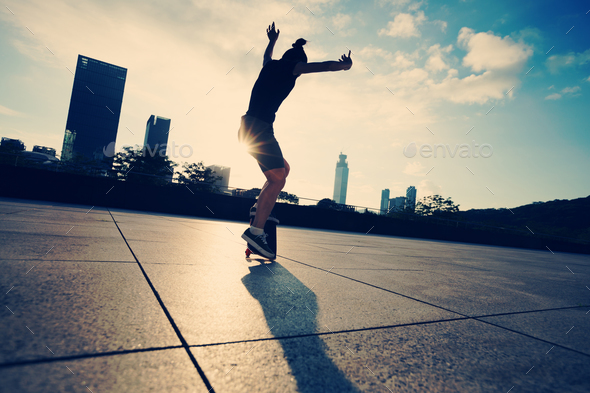Skateboarding in sunrise city Stock Photo by lzf | PhotoDune