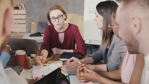 Successful Businesswoman Leading Office Meeting. Multiracial Happy Group Working on Marketing alt