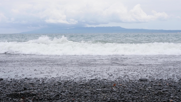 White Foam Ocean Waves at Black Volcanic Sand Beach Bali, Indonesia alt