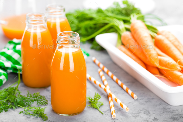 Fresh carrot and apple juice on white background. Carrot and apple juice - Stock Photo - Images